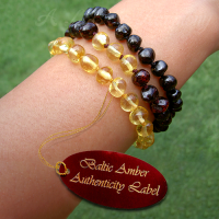 rare colour baltic amber adult bracelets on wrist in lemon, designer and crimson black, main image - a life in harmony amber